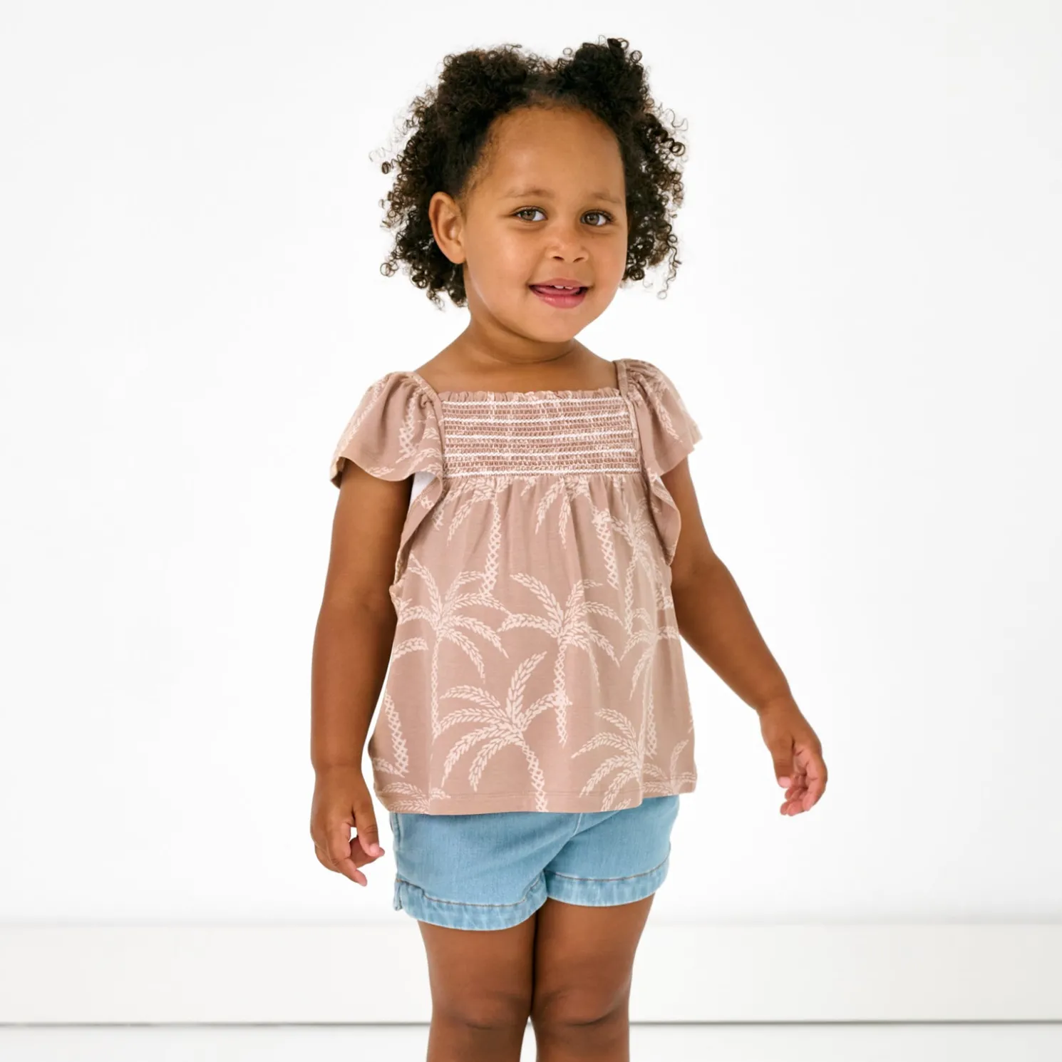 Sandy Palms Smocked Flutter Top