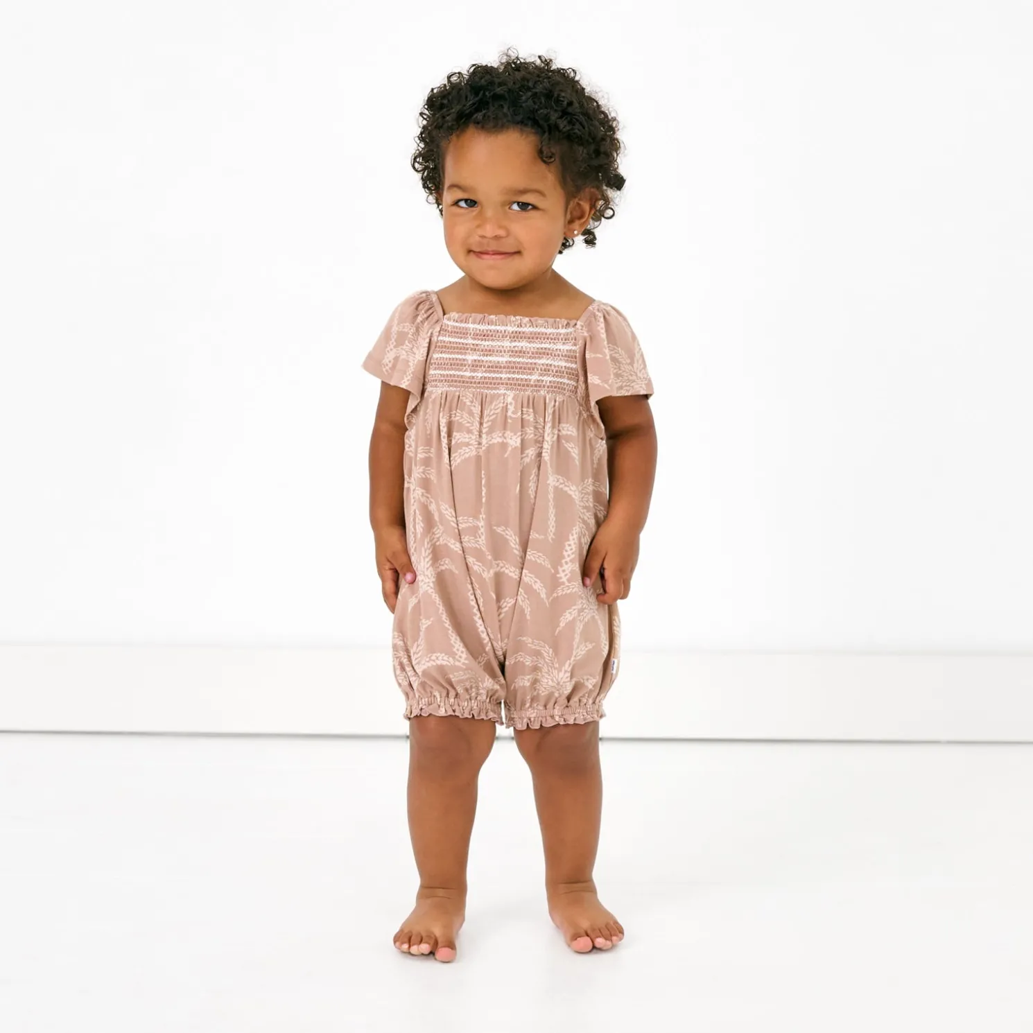 Sandy Palms Smocked Flutter Romper