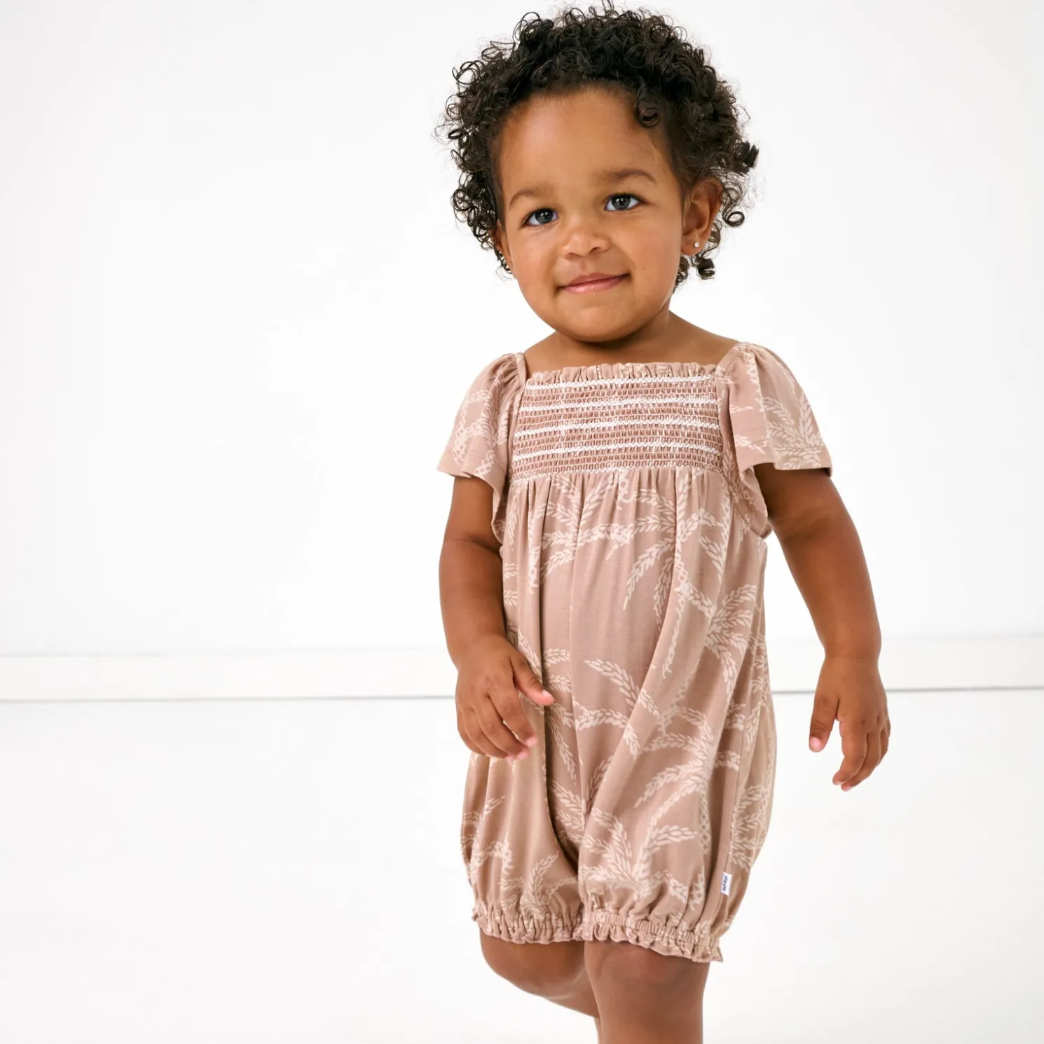 Sandy Palms Smocked Flutter Romper