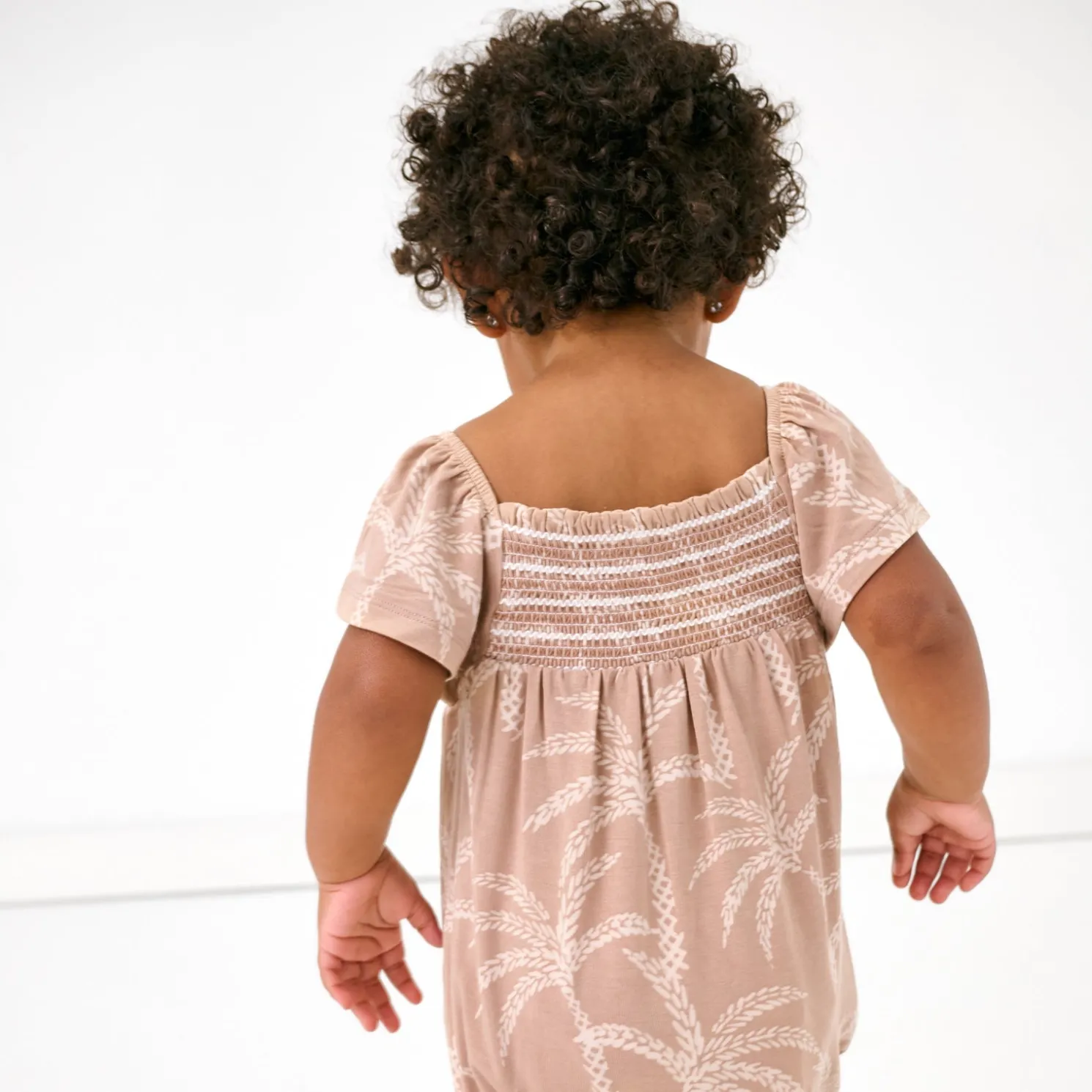 Sandy Palms Smocked Flutter Romper